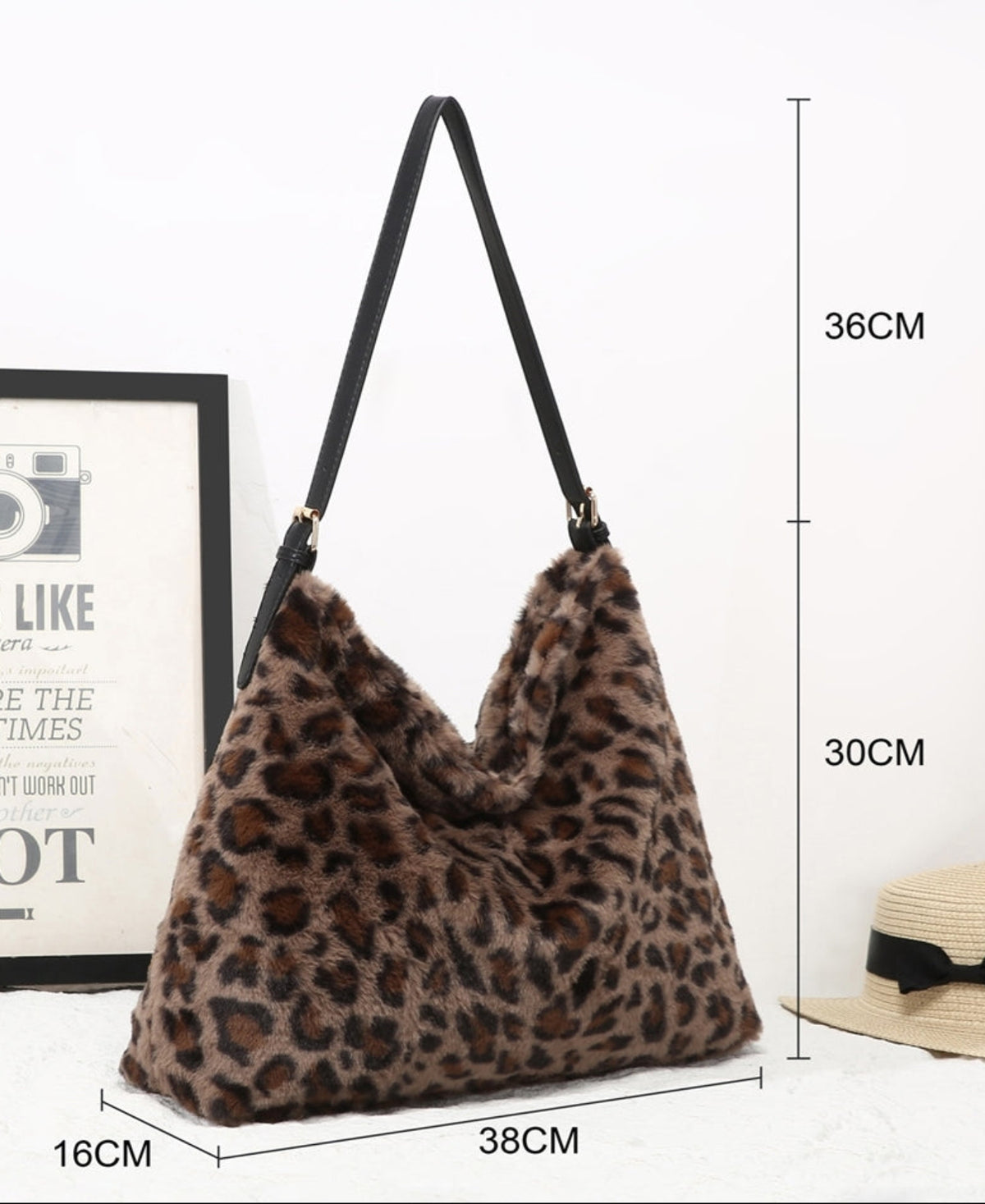 A leopard-print faux fur shoulder bag with a black strap, shown with dimension lines indicating measurements of 36cm height, 30cm depth, 38cm width, and 16cm height against a white background.
